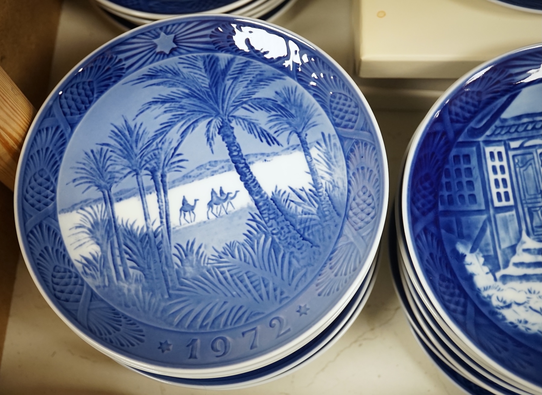 A large collection of Royal Copenhagen Christmas plates to include In the old farmyard, 1969 and In the desert 1972, with three boxes, each 18cm in diameter. Condition - good